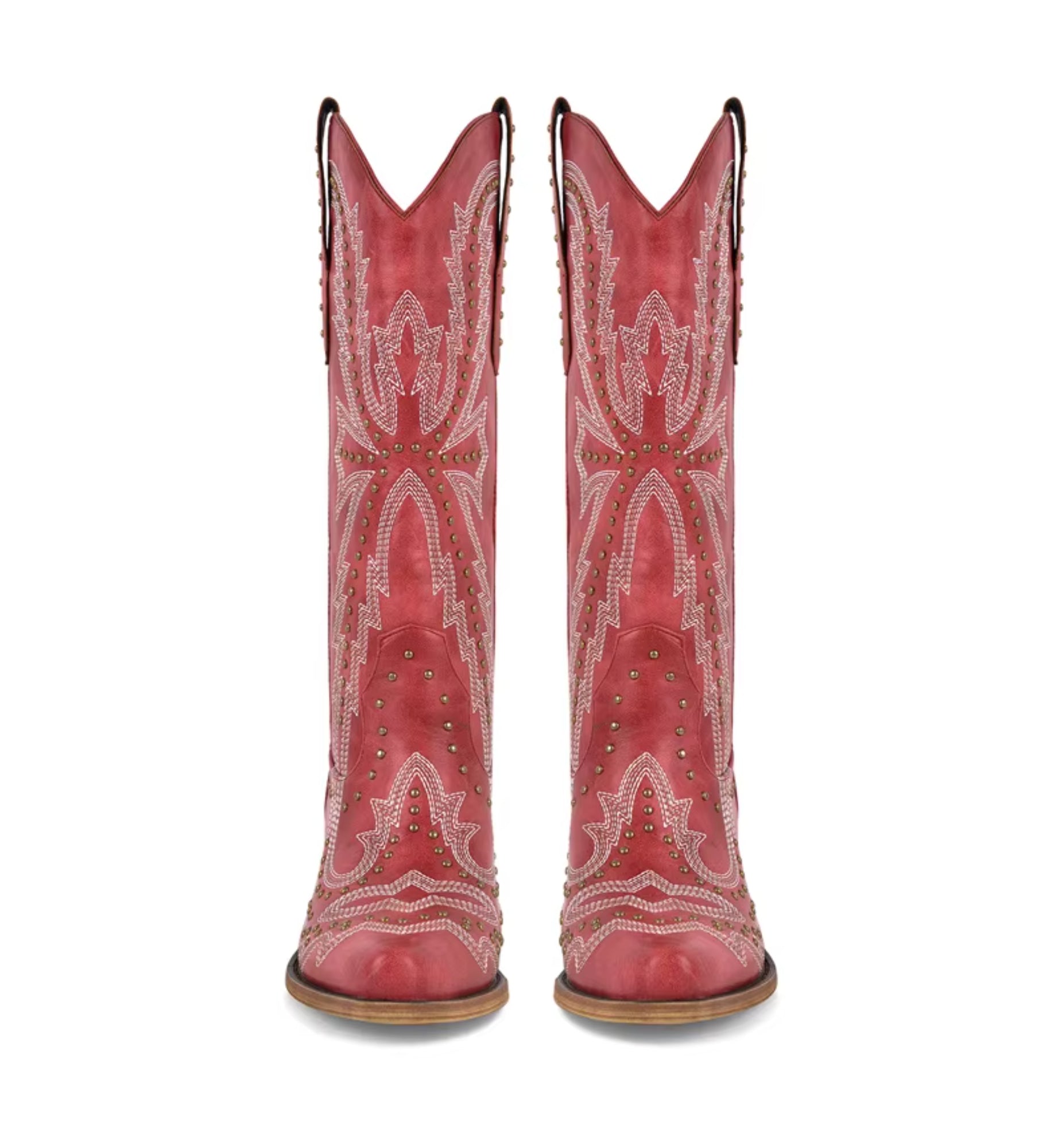 Red cowboy boots with white embroidery and studded details on a white background