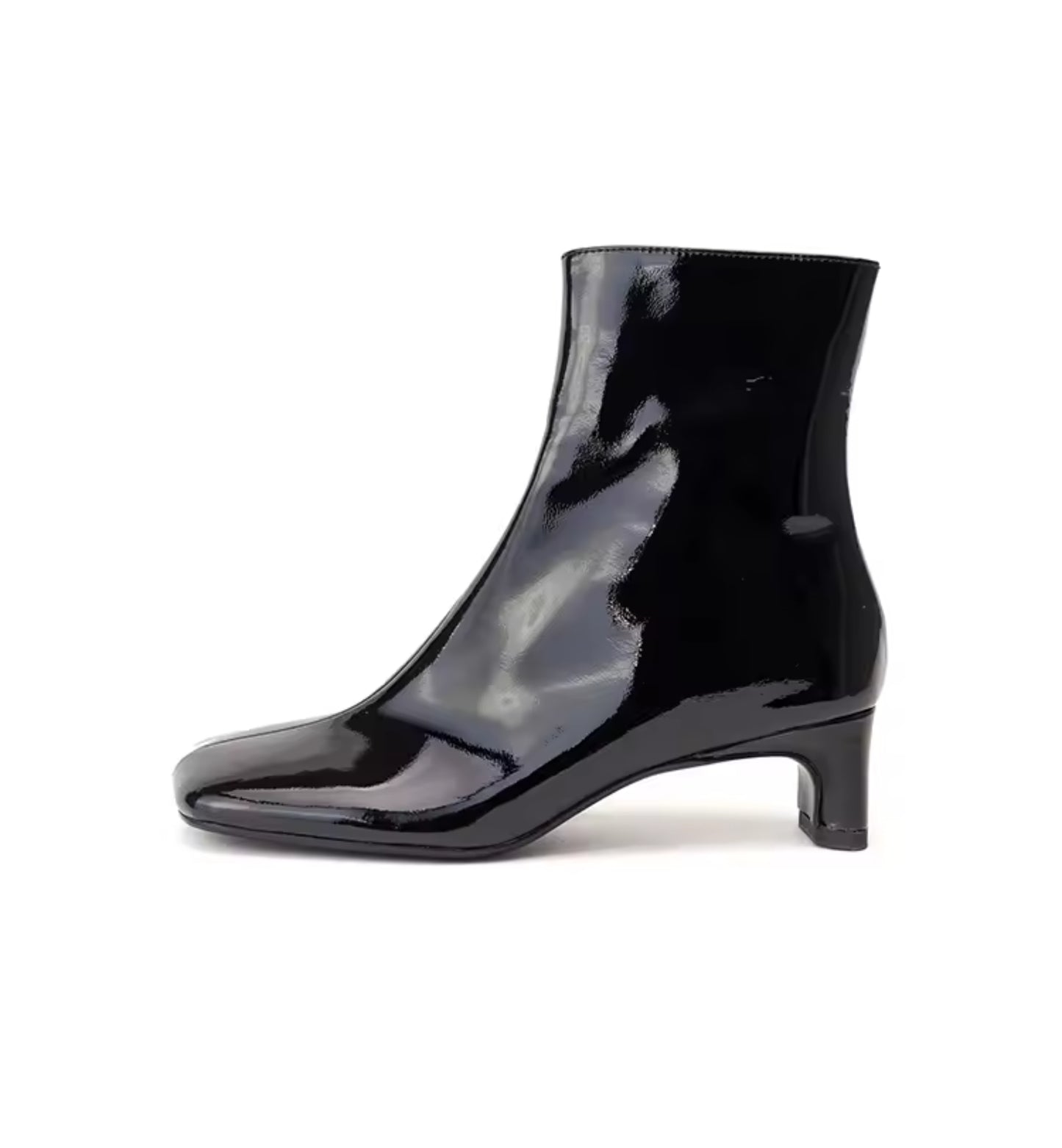 Black patent leather ankle boot on a white background