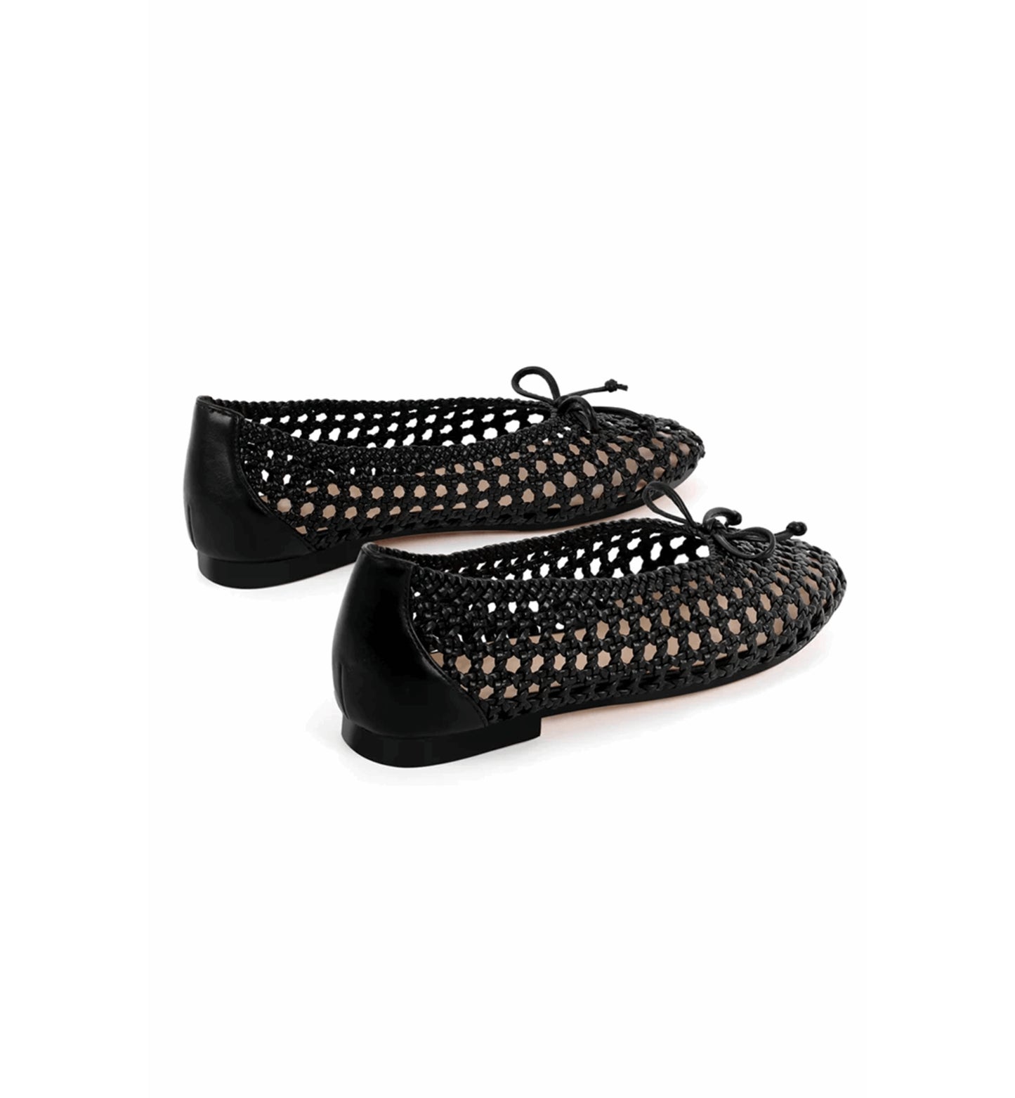 Black woven ballet flats on a white background