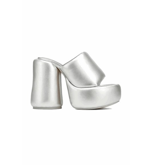 Silver high-heeled shoes on a white background