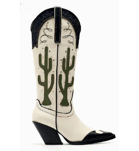 White cowboy boot with green cactus design on a white background