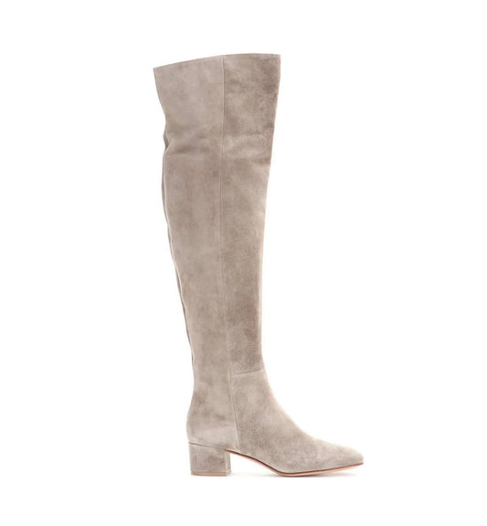 Beige suede knee-high boot on a white background