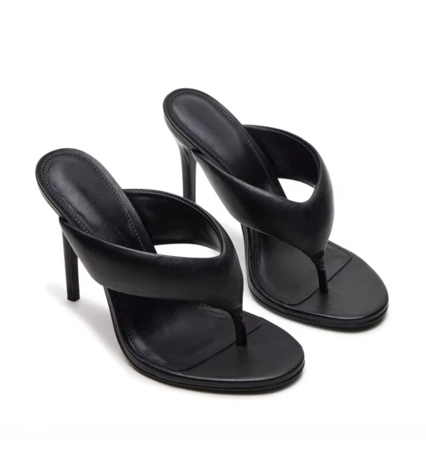 Black high-heeled sandals on a white background