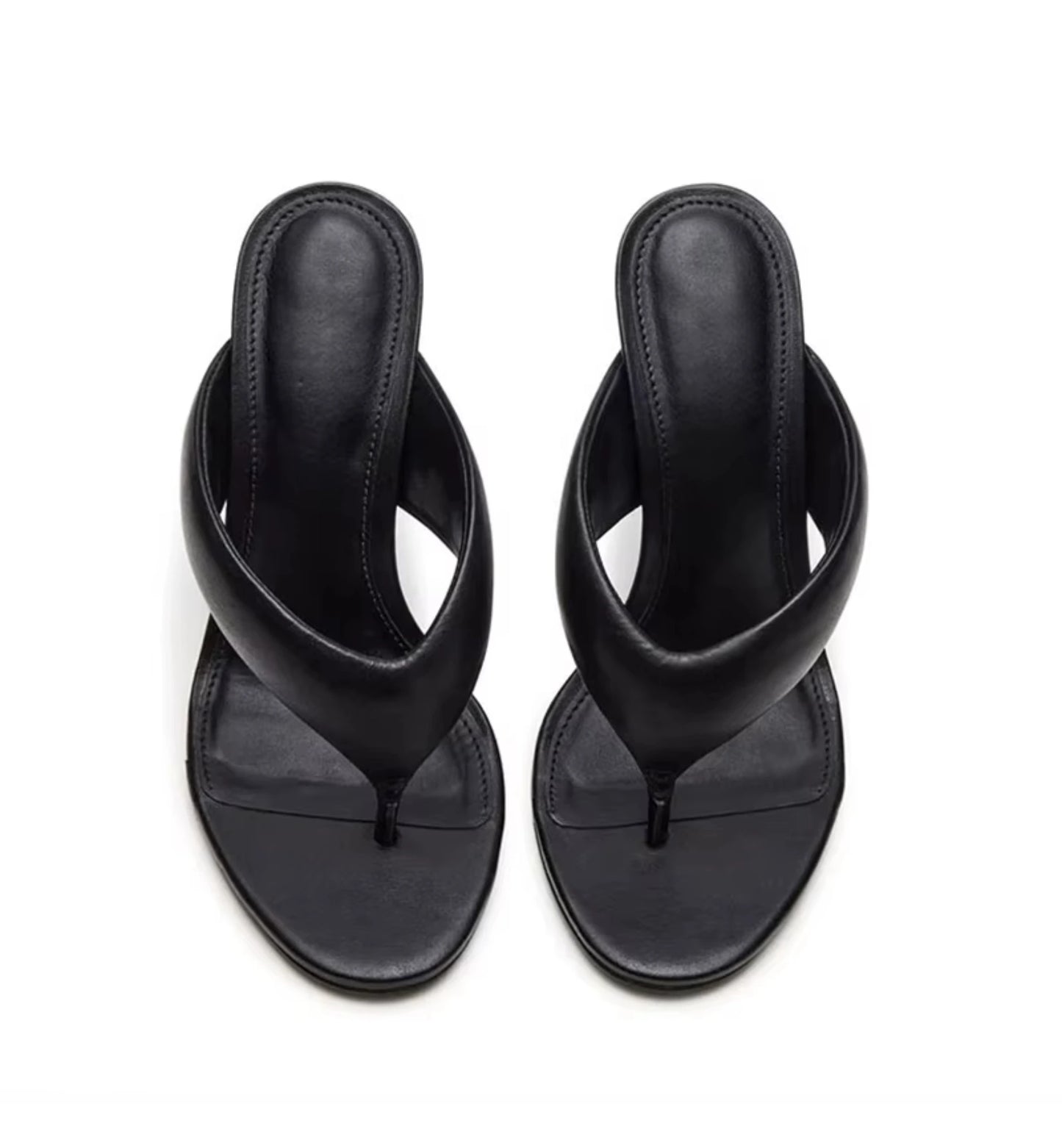 Pair of black sandals on a white background