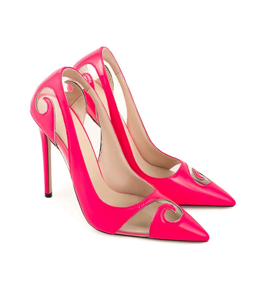 Pair of bright pink high-heeled shoes with a decorative element on a white background