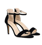 Black high-heeled sandals with thin straps 