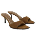 Pair of brown high-heeled sandals