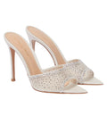 White high-heeled shoes with crystal embellishments