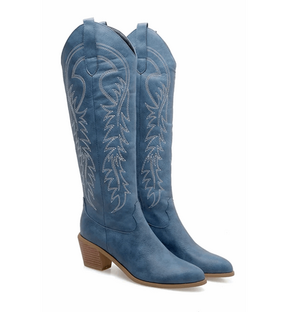 Blue cowboy boots with intricate designs on a white background