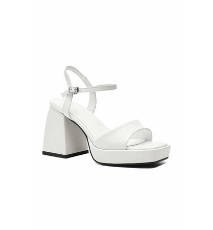 White sandal with block heel on a white background