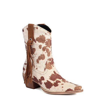 Cowboy boot with brown and white cowhide pattern on a white background