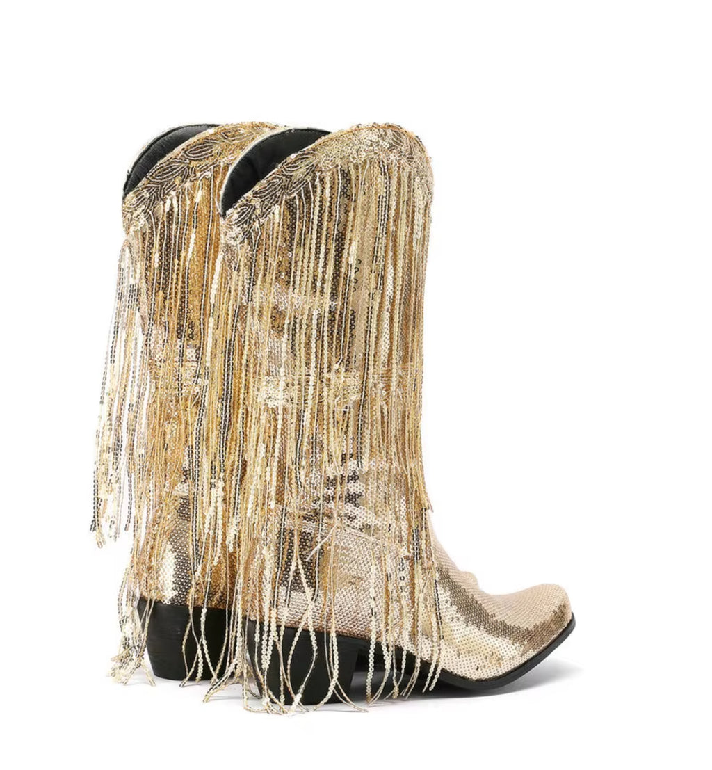 Gold sequin and fringe boots on a white background