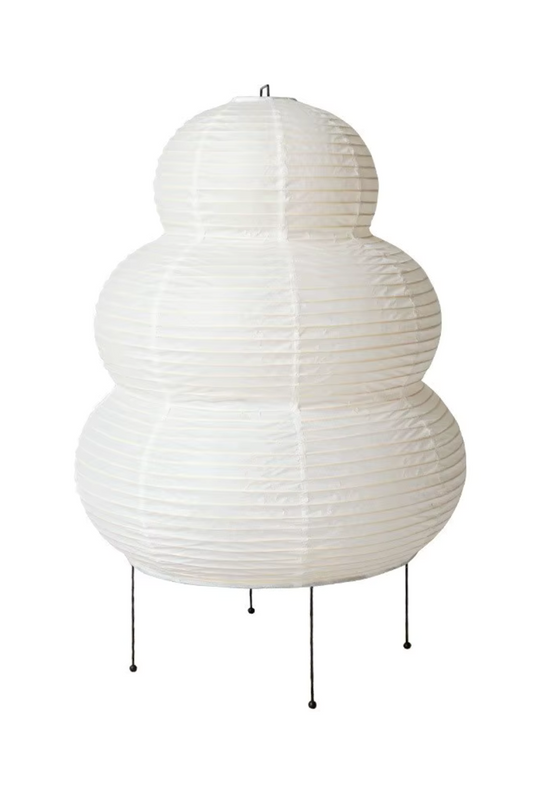 White rice paper floor lamp with sculptural rounded shape and thin metal stand.