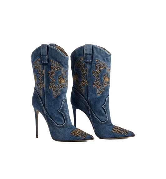 Pair of blue high-heeled cowboy boots with intricate gold embroidery on a white background
