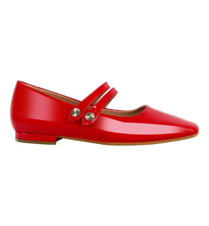 Red flat shoe with a strap on a white background