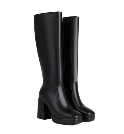 Black knee-high boots on a white background