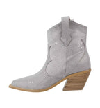 Silver studded ankle boot on a white background