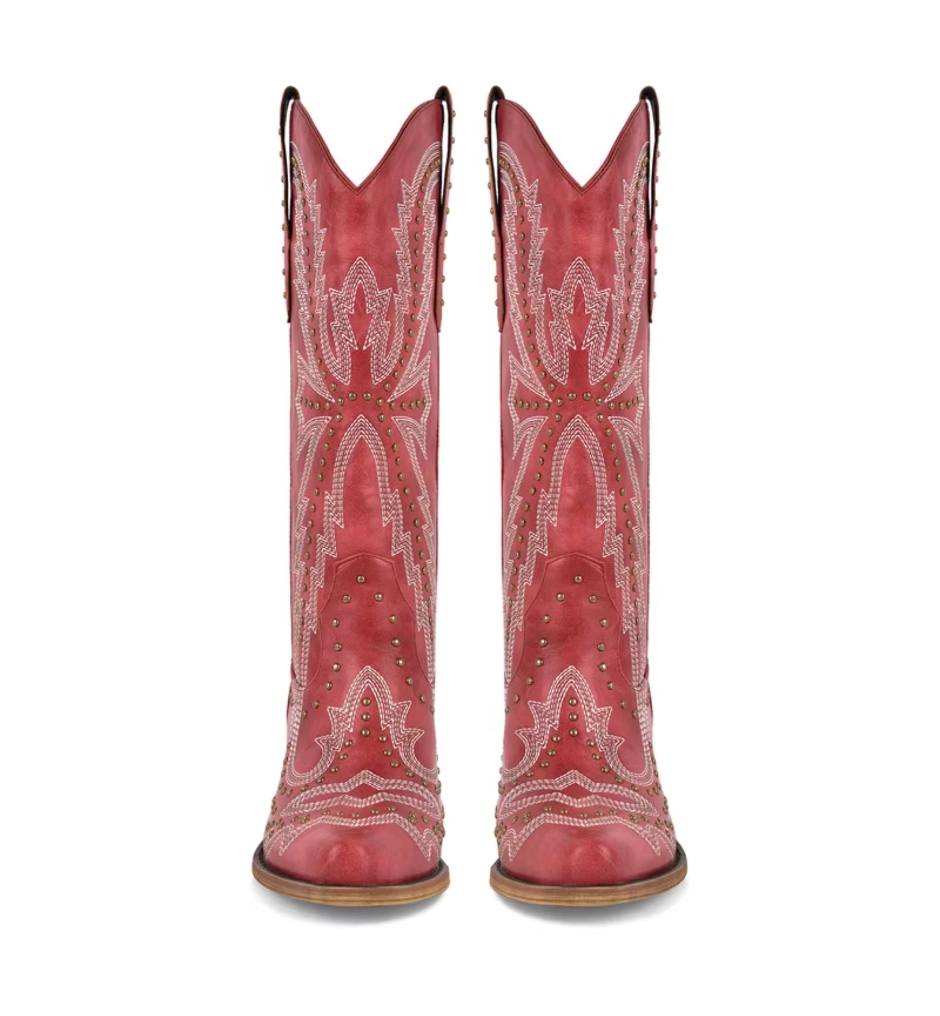 Red cowboy boots with white embroidery and studded details on a white background