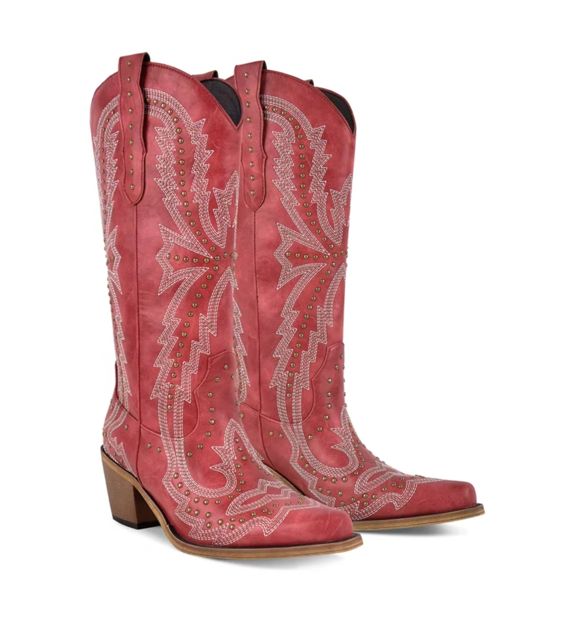 Red cowboy boots with intricate white embroidery on a white background