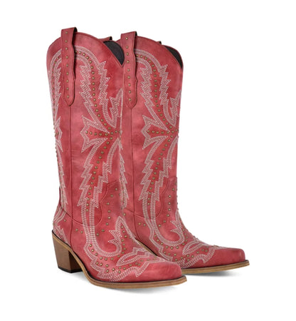 Red cowboy boots with intricate white embroidery on a white background