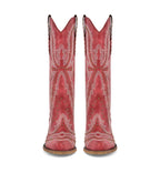 Red cowboy boots with white embroidery and studded details on a white background