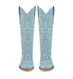 Pair of light blue cowboy boots with decorative patterns on a white background