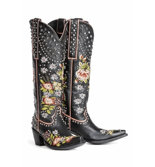Black cowboy boots with floral embroidery on a white background