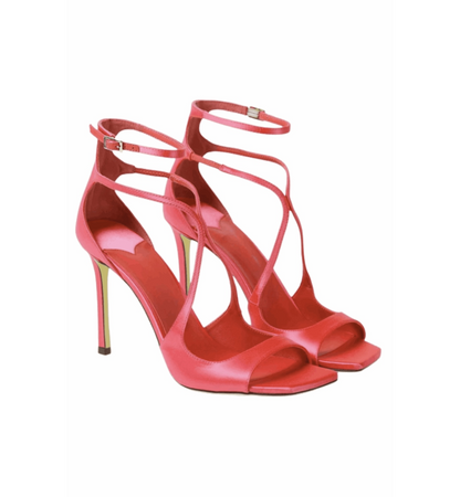Red high-heeled sandals with strappy design on a white background