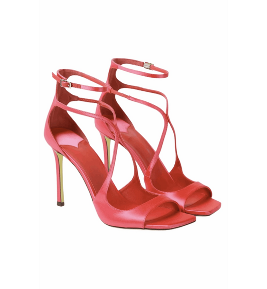 Red high-heeled sandals with strappy design on a white background