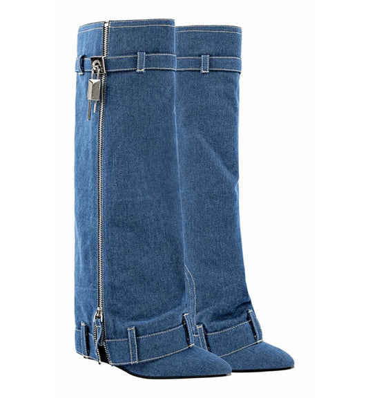 Pair of blue denim knee-high boots with zippers on a white background