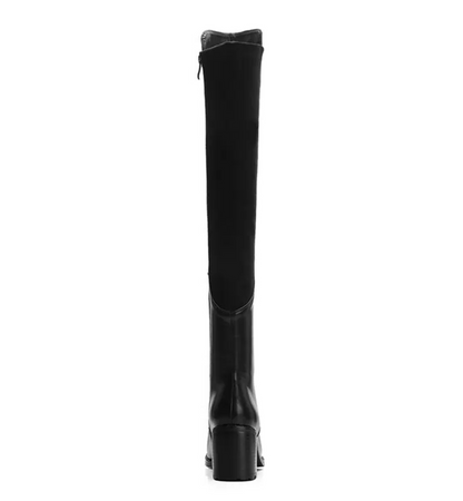 Black knee-high boot on a white background