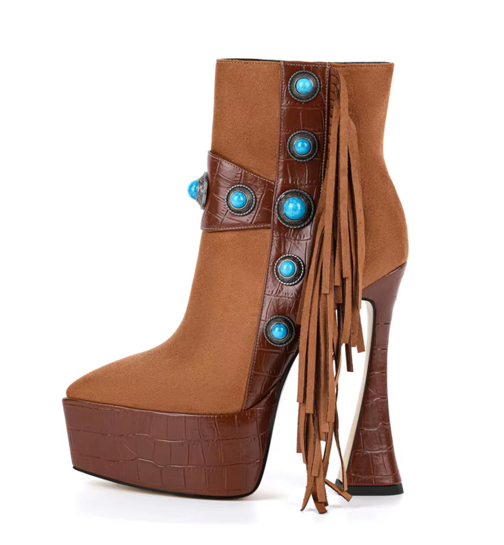 Brown platform boot with turquoise embellishments on a white background