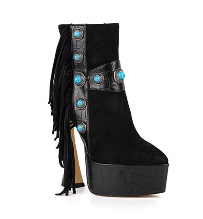 Black platform boot with fringes and turquoise embellishments on a white background