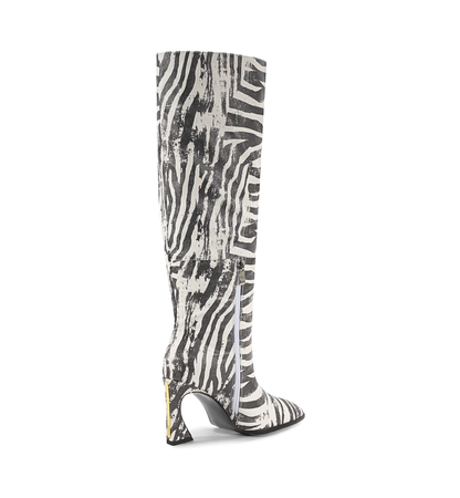 Zebra patterned knee-high boot on a white background