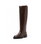 Brown knee-high boot on a white background
