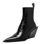 Black leather ankle boot with wedge heel on a white background