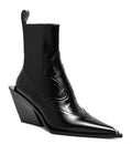 Black leather ankle boot with wedge heel on a white background