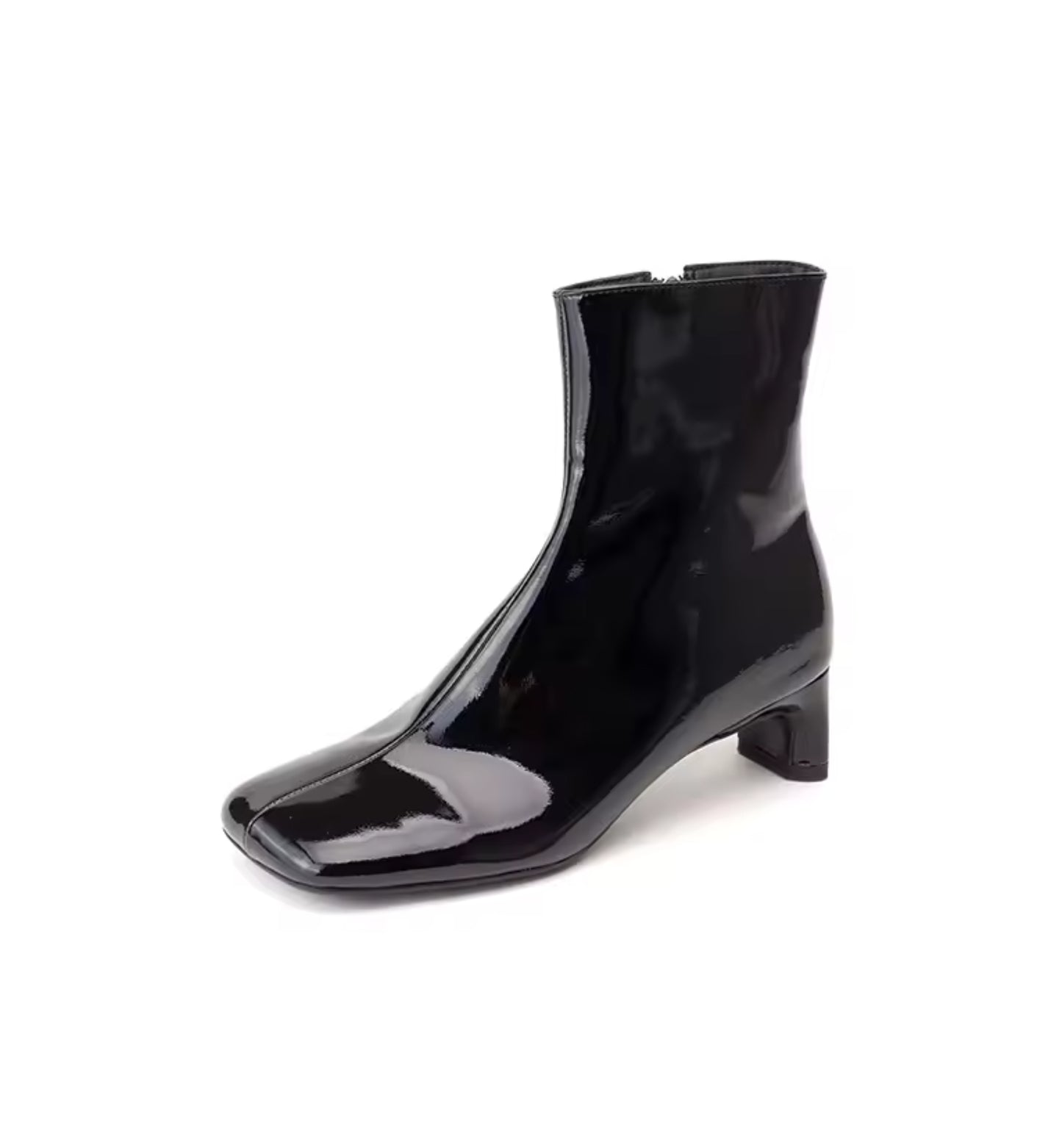 Black patent leather ankle boot on a white background