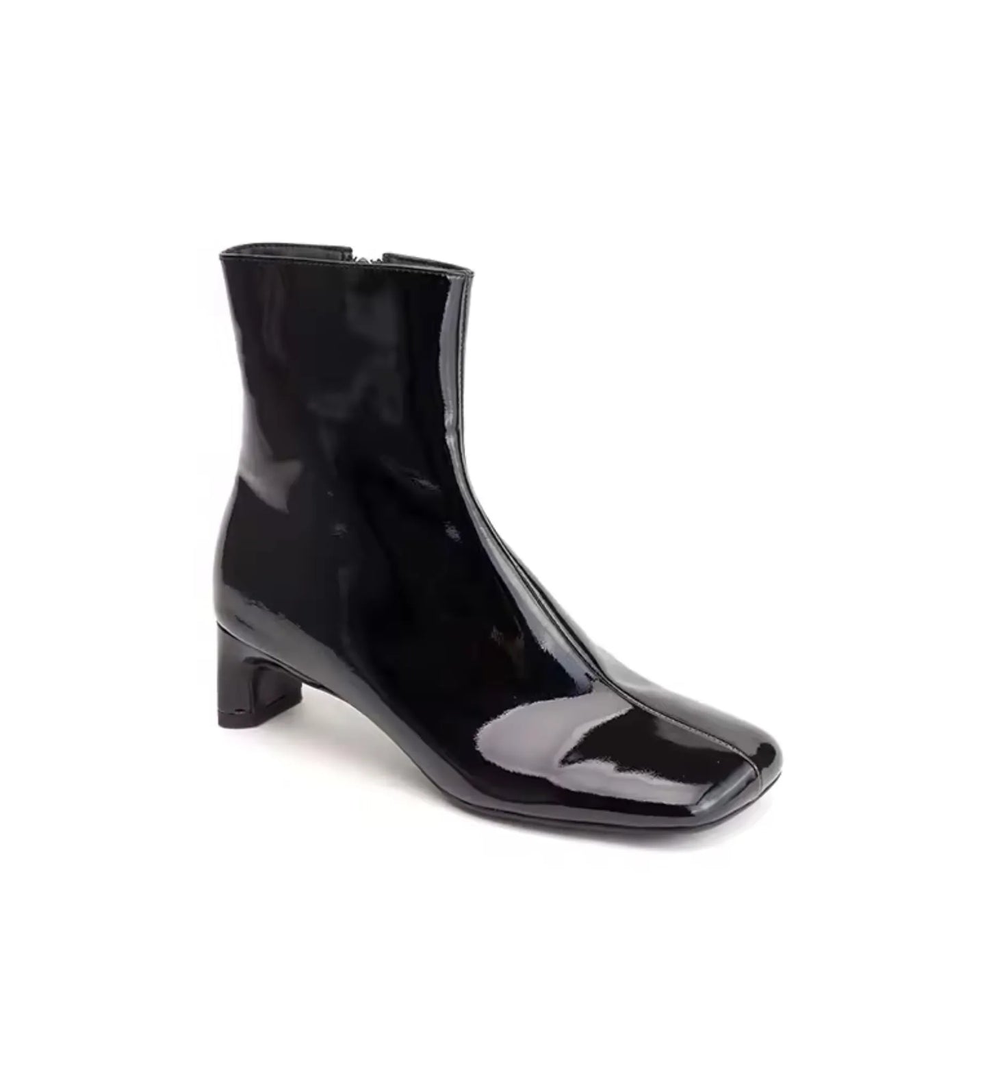 Black patent leather ankle boot on a white background