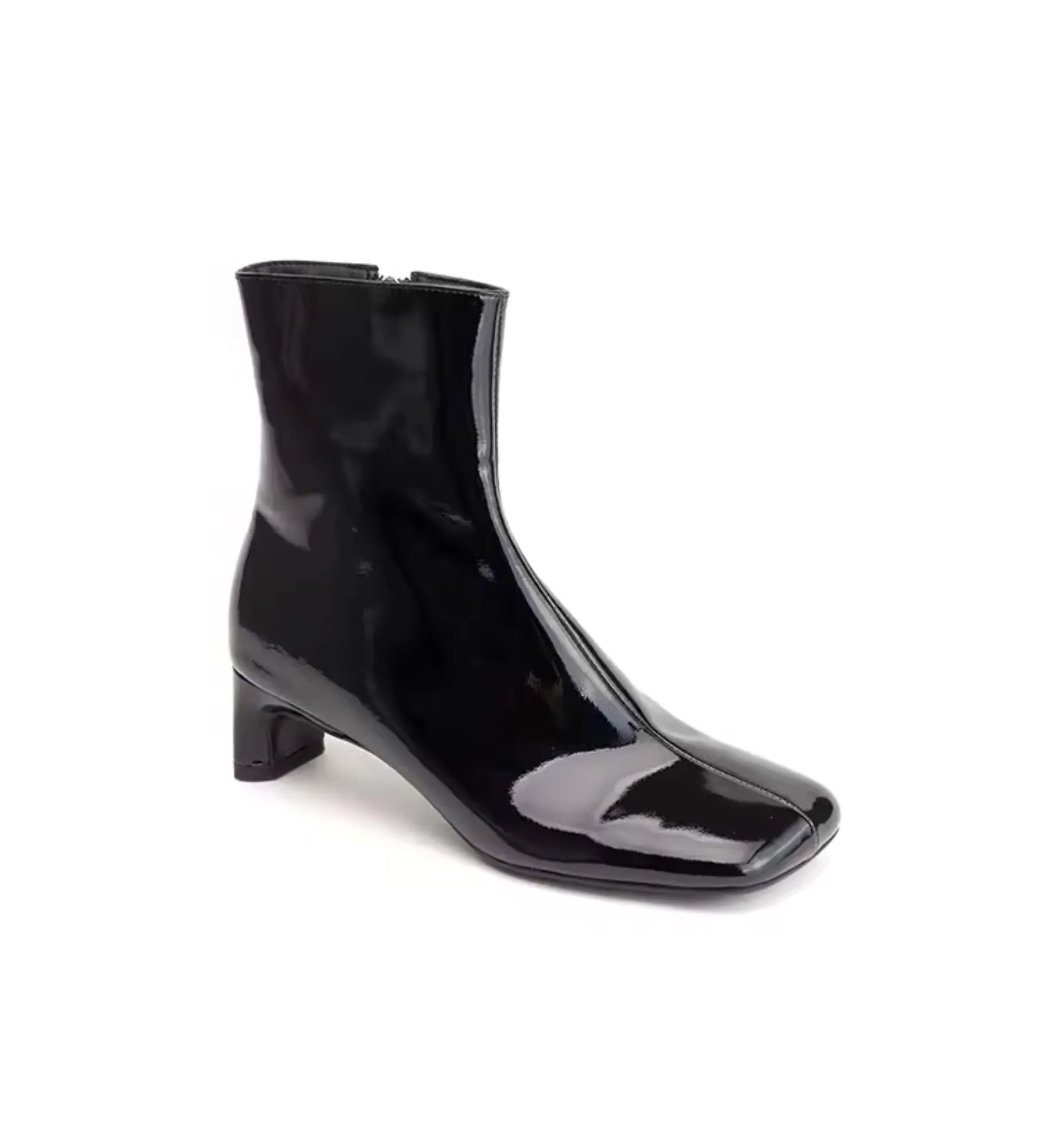 Black patent leather ankle boot on a white background