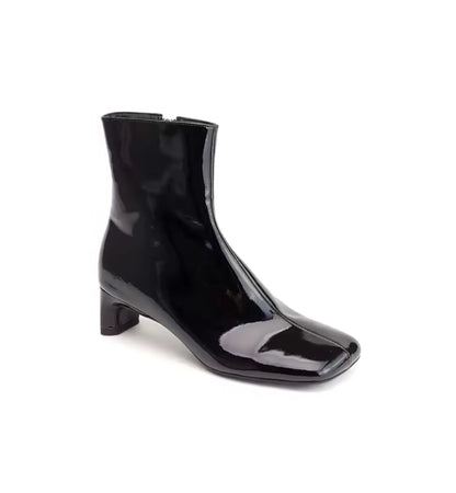 Black patent leather ankle boot on a white background
