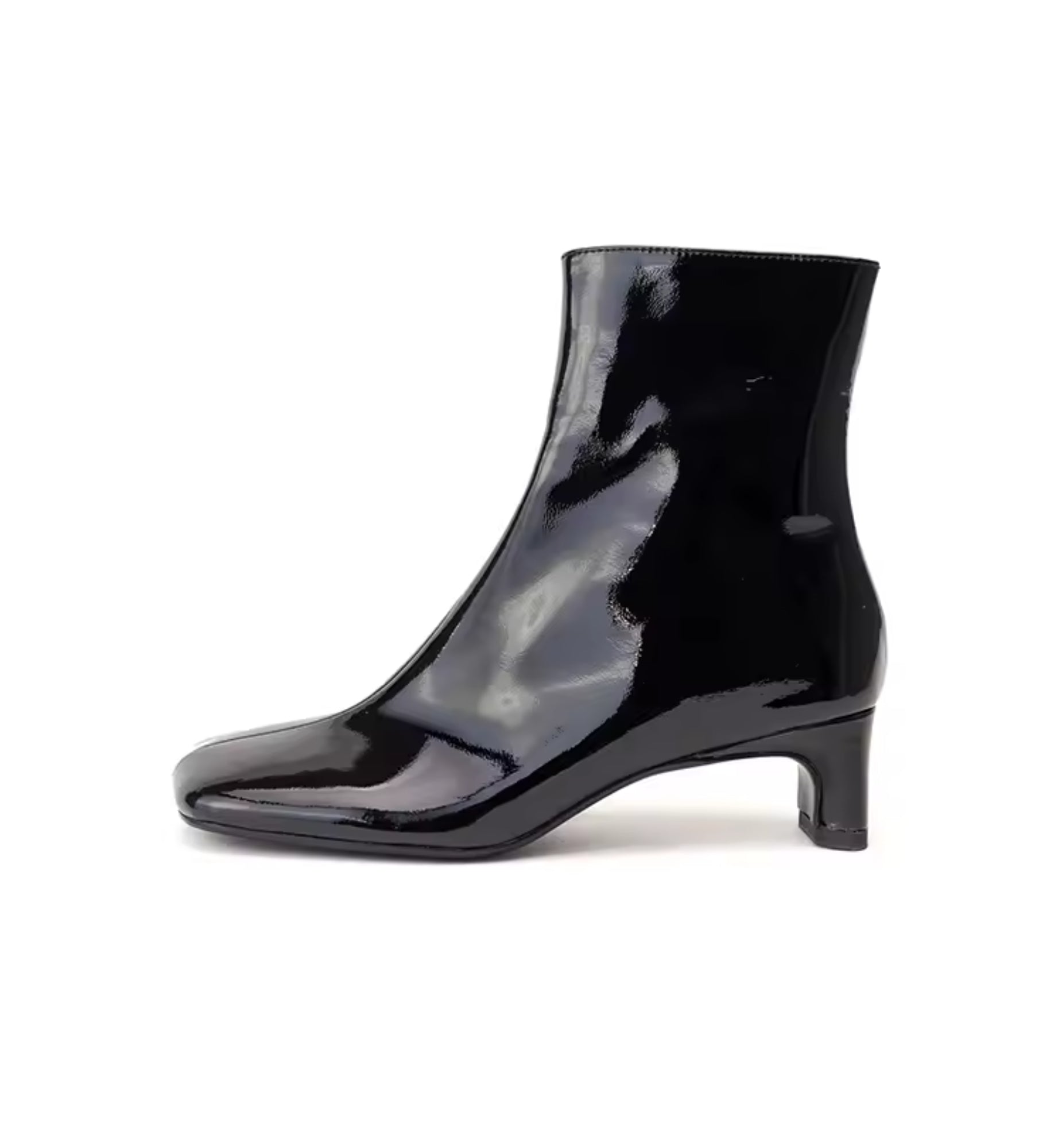 Black patent leather ankle boot on a white background