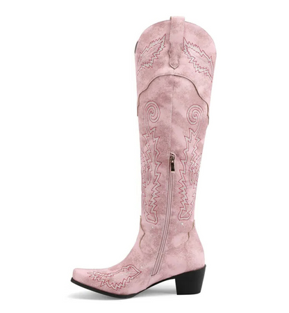 Pink cowboy boot with intricate designs on a white background