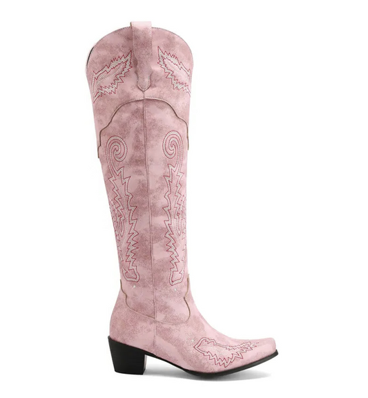 Pink cowboy boot with intricate designs on a white background