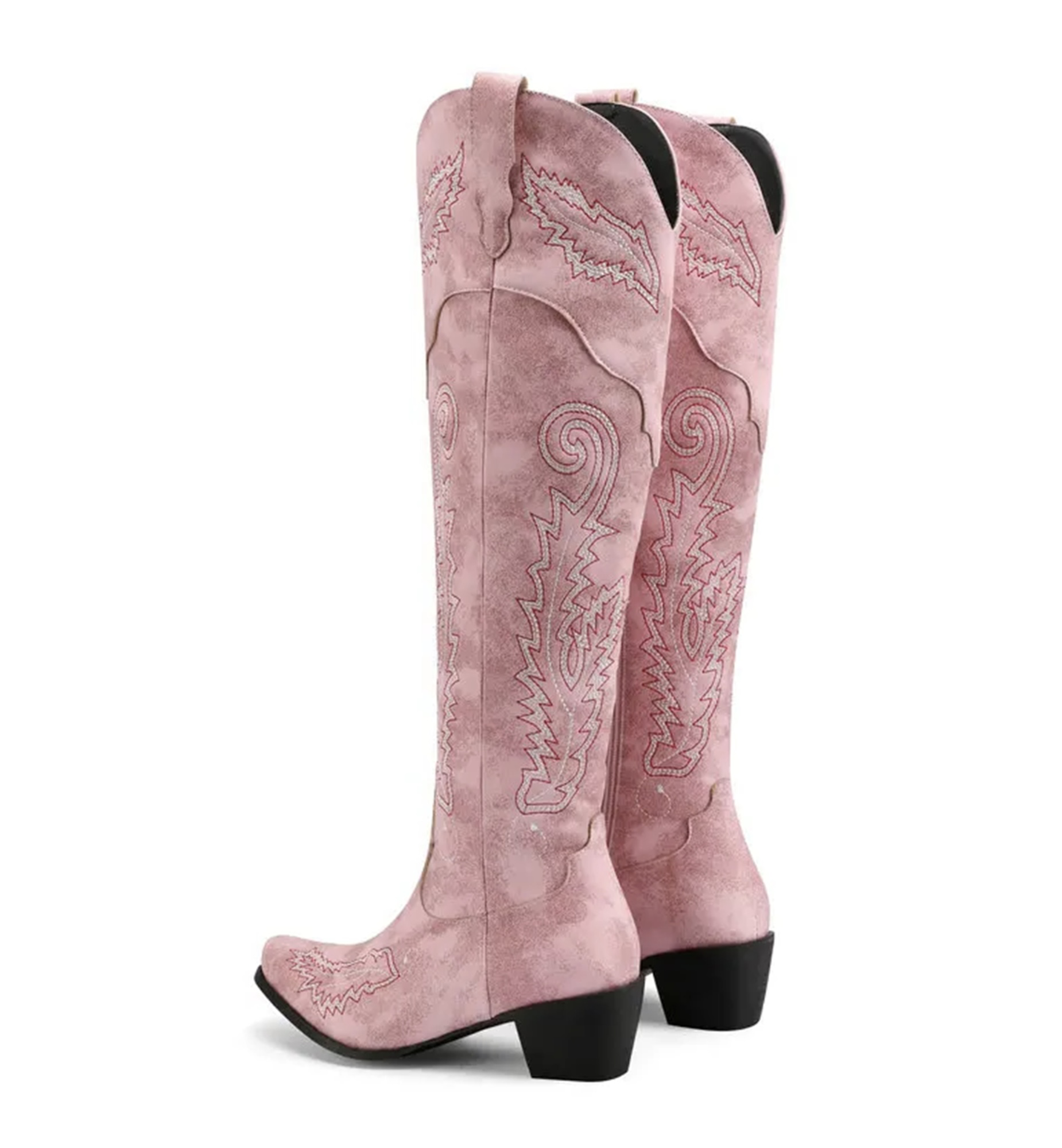 Pink cowboy boots with intricate designs on a white background