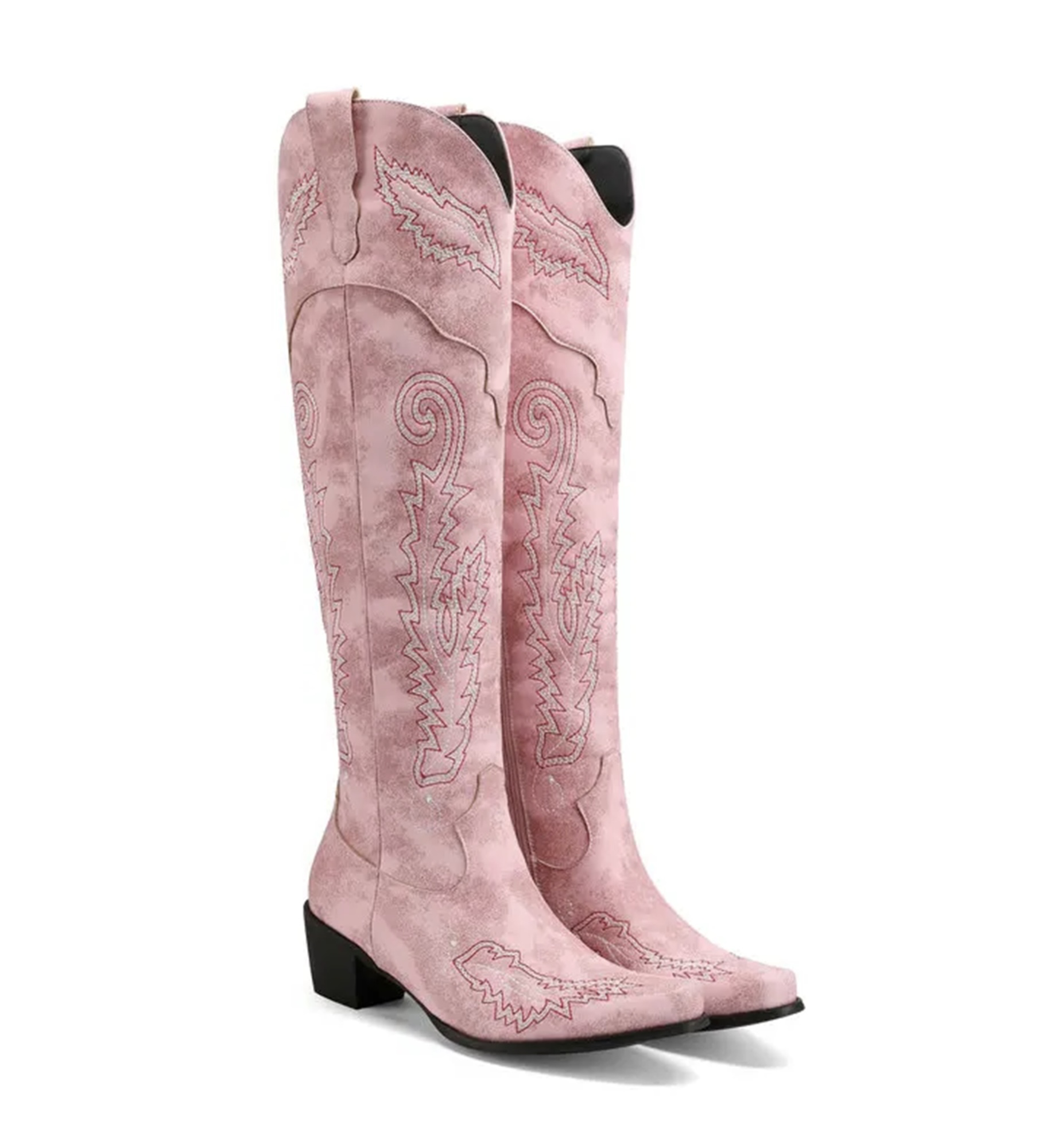 Pink cowboy boots with intricate designs on a white background