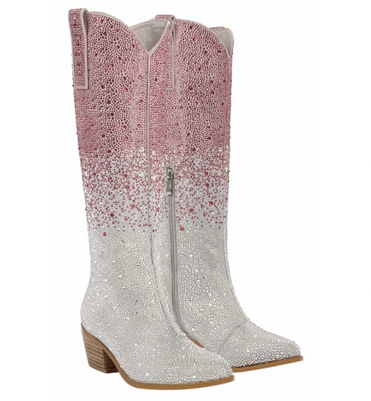 Pair of cowboy boots with pink and silver gradient design on a white background