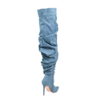 Blue denim knee-high boot on a white background