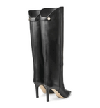 Black knee-high boots with high heels on a white background