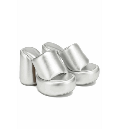 Silver high-heeled sandals on a white background